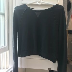 Black cropped sweater with black leather accents